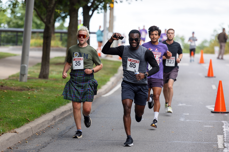 A group of men running in the IU Indianapolis Jaguar 5k. 