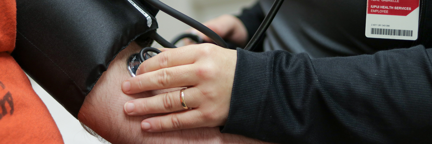 A student getting their blood pressure checked.