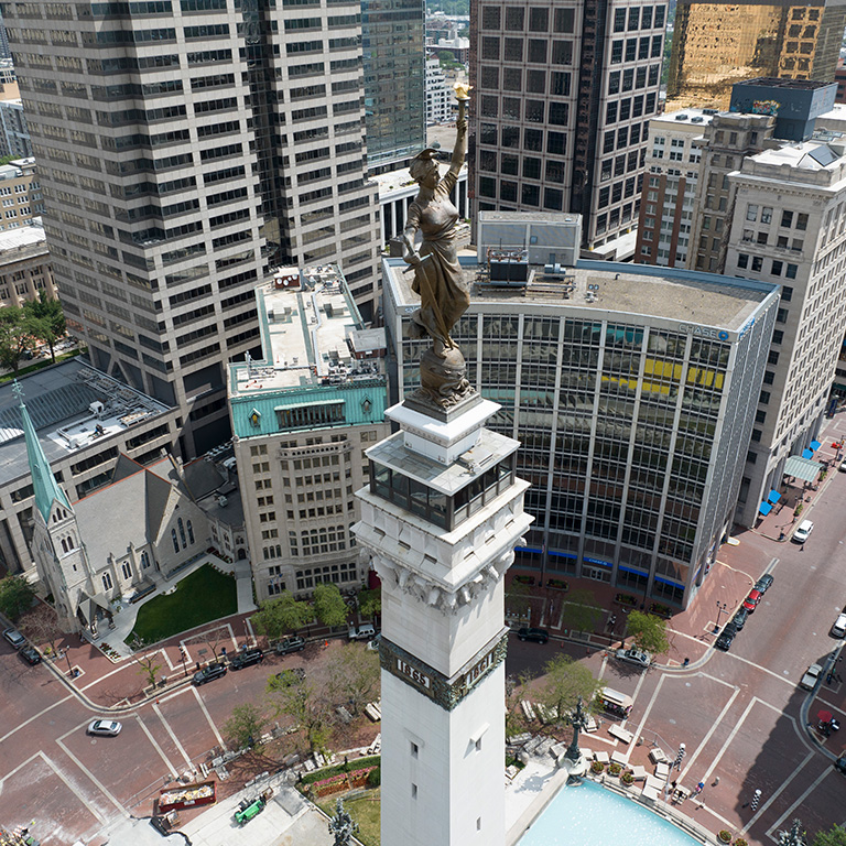 Aerial photo of Monument Circle in downtown Indianapolis on a sunny day.