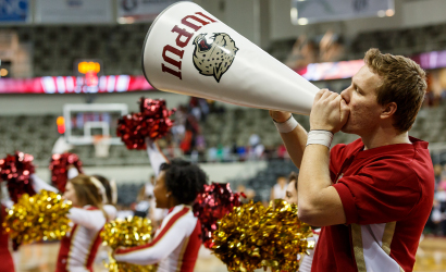 Cheerleaders cheering on the jaguars at the IUPUI basketball game.